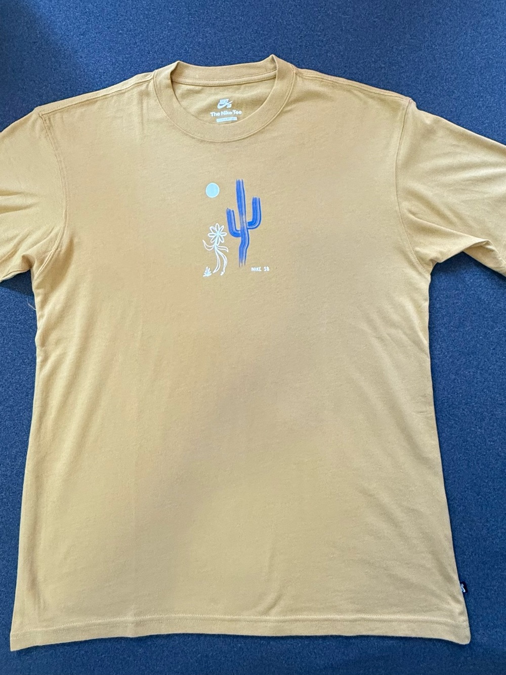 Nike Short-Sleeve Tan Tee with Blue Cactus Graphic